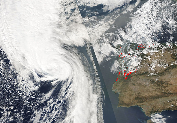 Figure 1. Evolution of Hurricane Ophelia to an intense post-tropical cyclone, seen by Aqua MODIS true colour image on 15/10/2017. Red dots indicate fire hotspot detection.